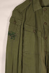 Real 1970 Australian Army OD Fatigue shirt with rank insignia, size unreadable.