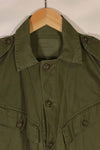 Real 1970 Australian Army OD Fatigue shirt with rank insignia, size unreadable.