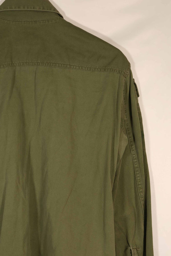 Real 1970 Australian Army OD Fatigue shirt with rank insignia, size unreadable.