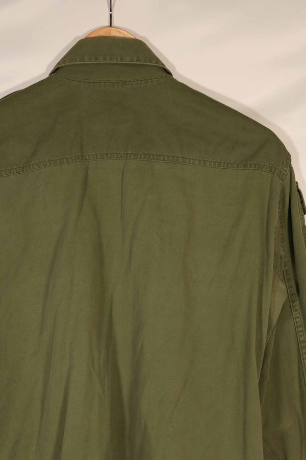 Real 1970 Australian Army OD Fatigue shirt with rank insignia, size unreadable.