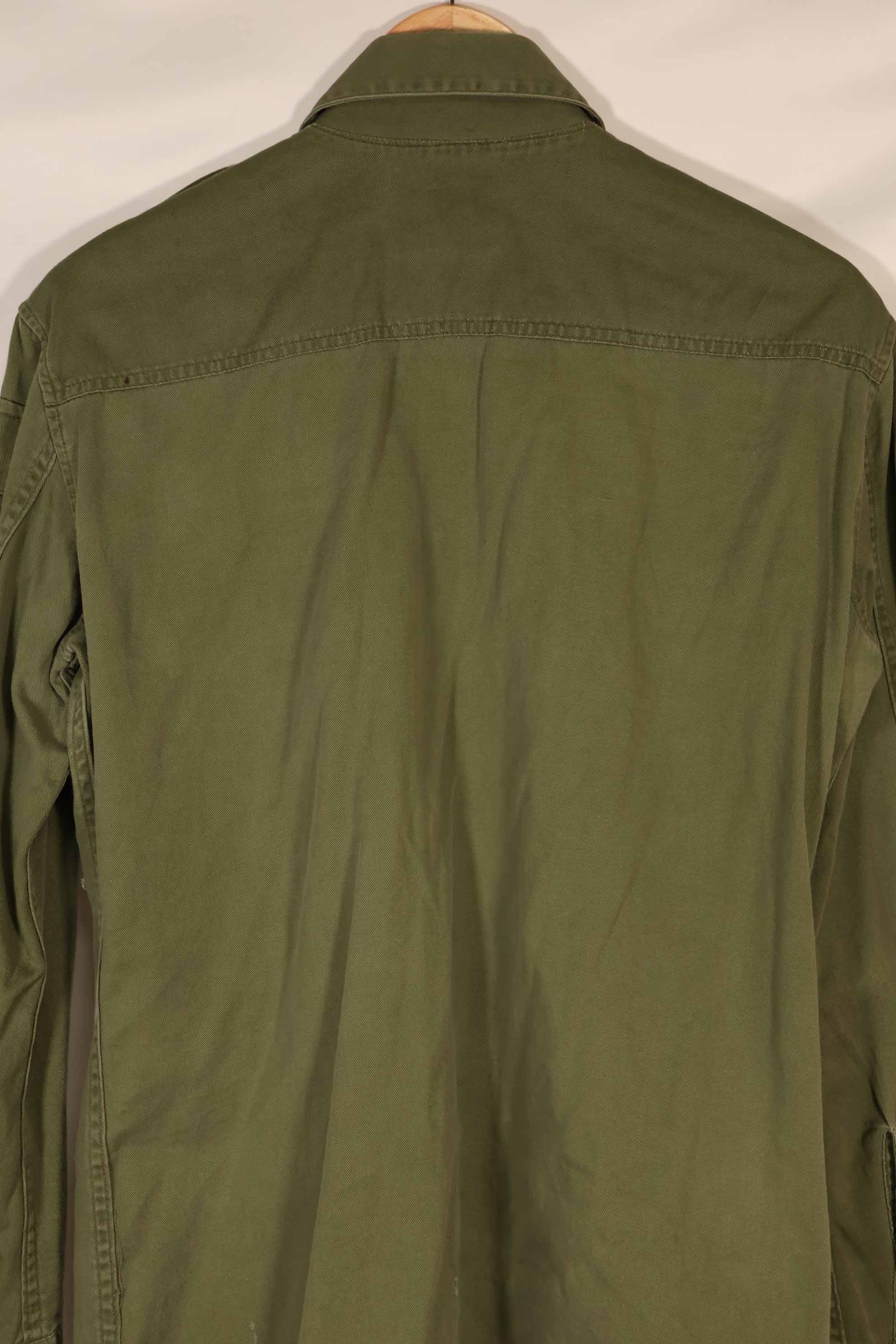 Real 1970 Australian Army OD Fatigue shirt with rank insignia, size unreadable.