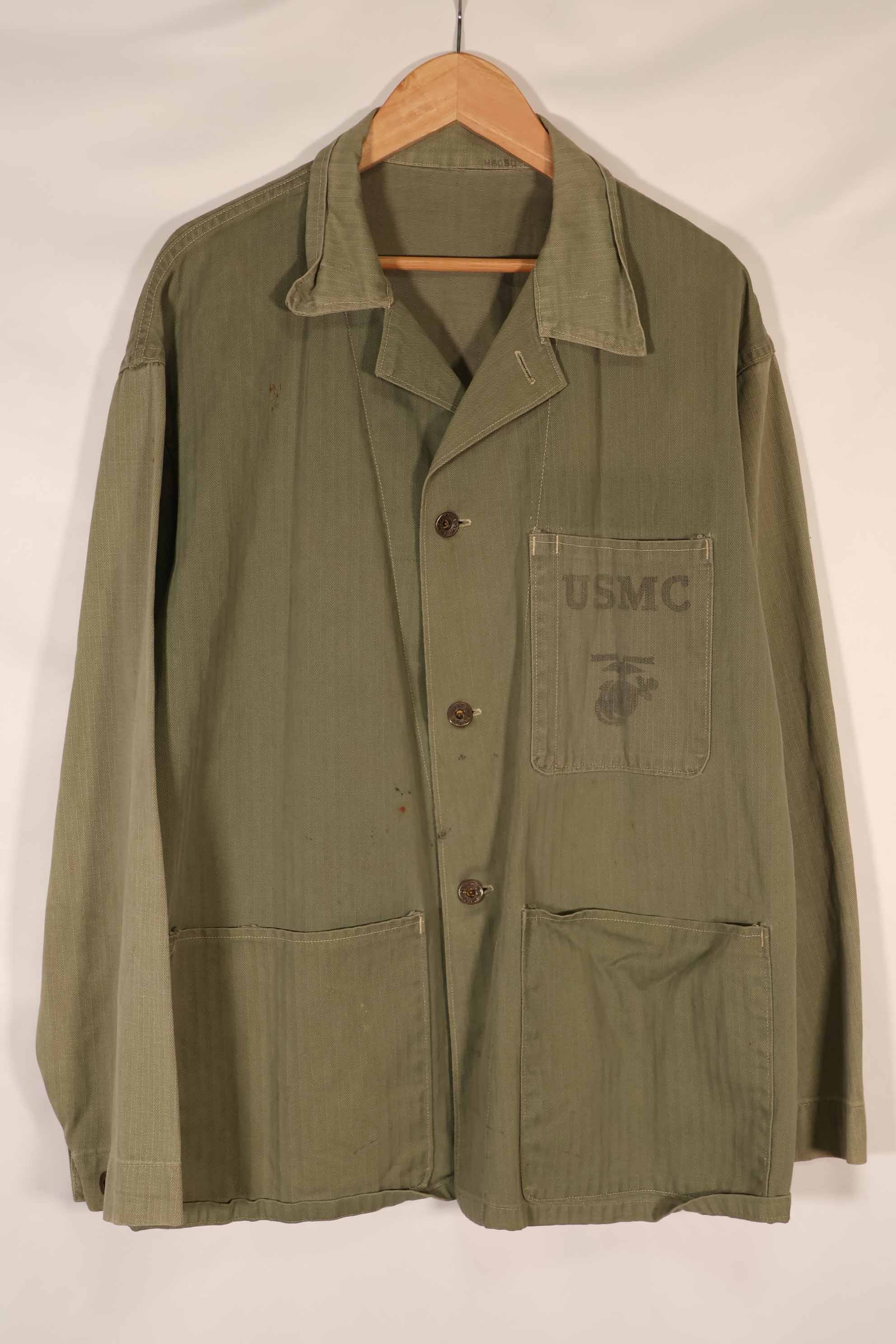 Real 1940s U.S. Marine Corps USMC M41 HBT utility jacket, faded, stained.