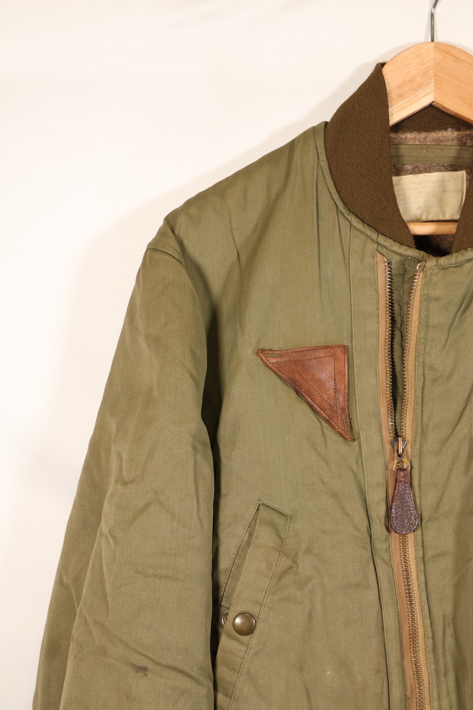 1940s, estimated age 38–40, U.S. Army Air Forces (USAAF) B-15A flight jacket, modified with shearling, used