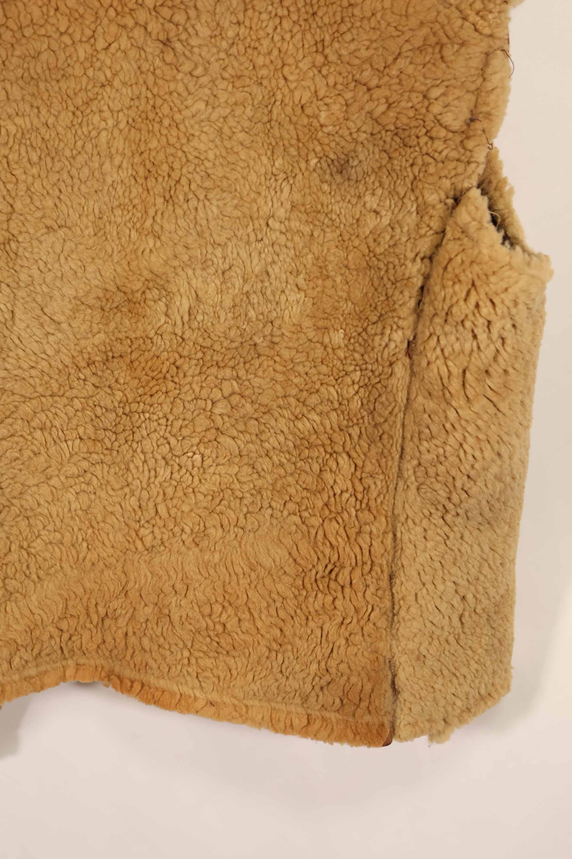 Civilian 1960s-70s sheepskin vest, used, scratches, stains.