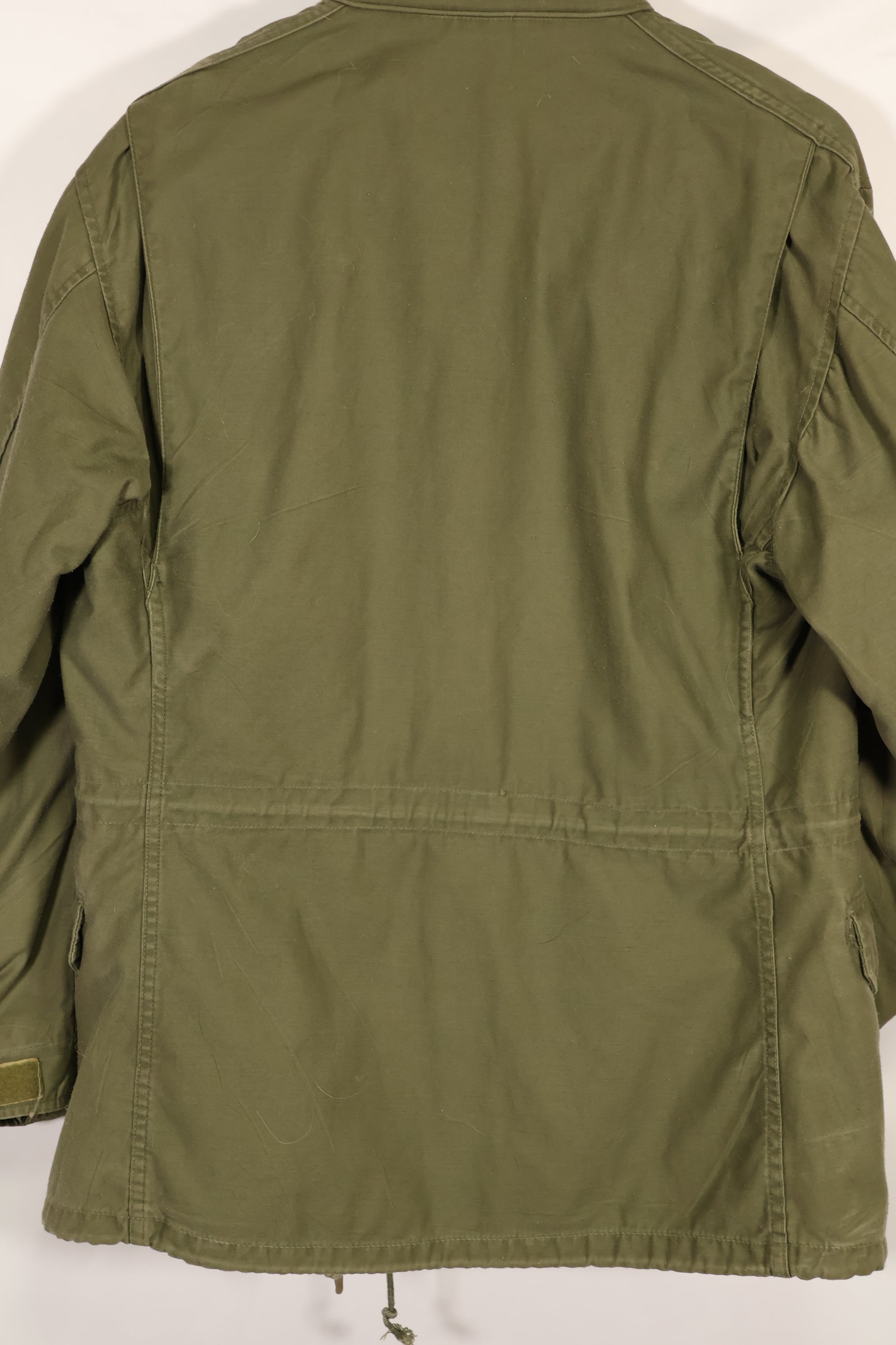 Real owned by former SF member, first model M65 field jacket, estimated 1965-1966, used.