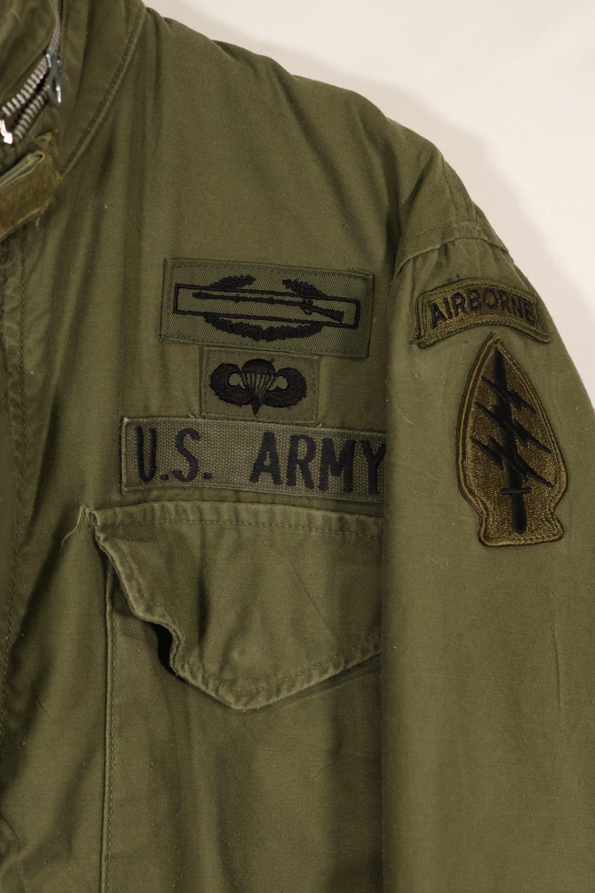 Real owned by former SF member, first model M65 field jacket, estimated 1965-1966, used.