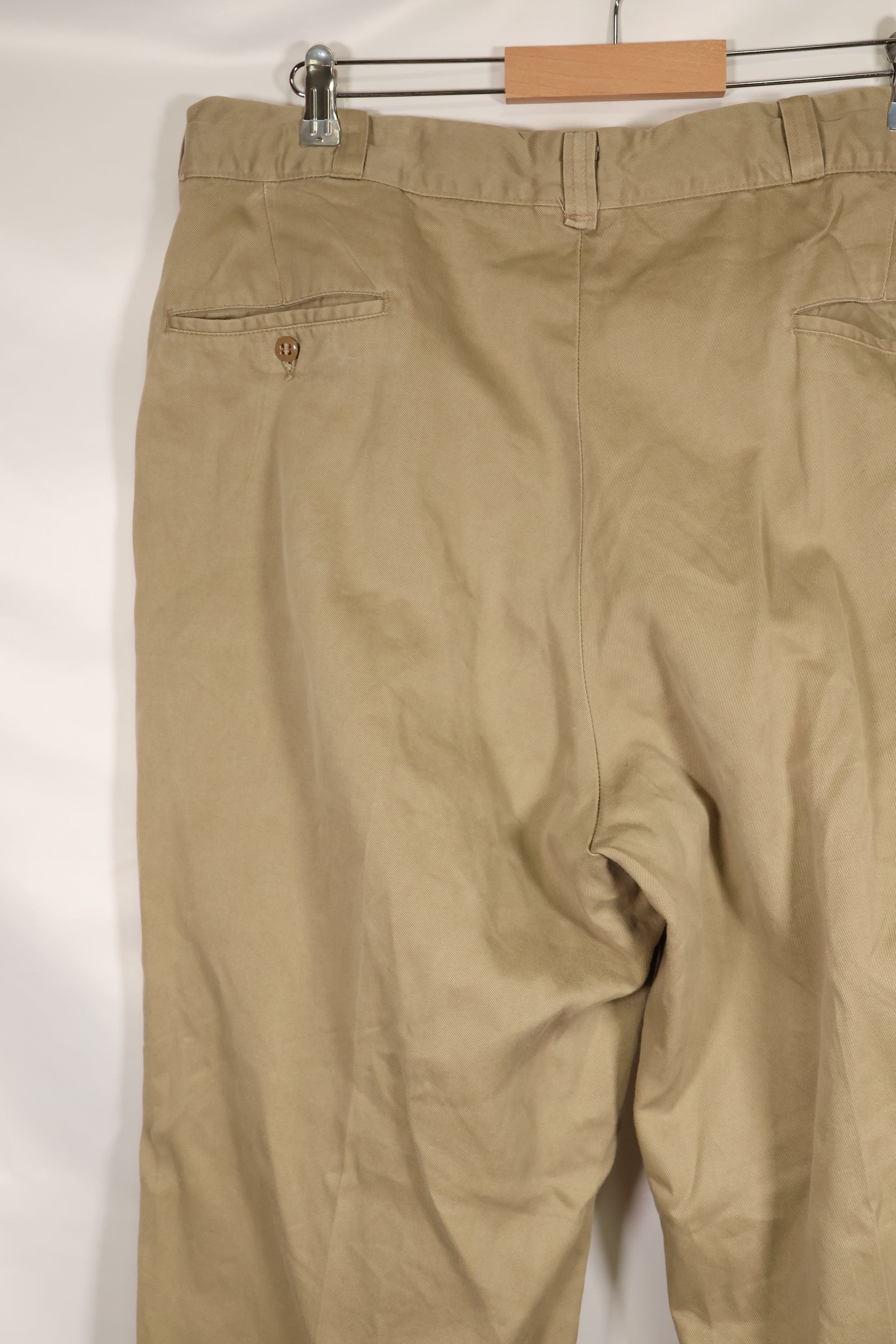 1960s, estimated 34-36 US Army cotton khaki pants, used.