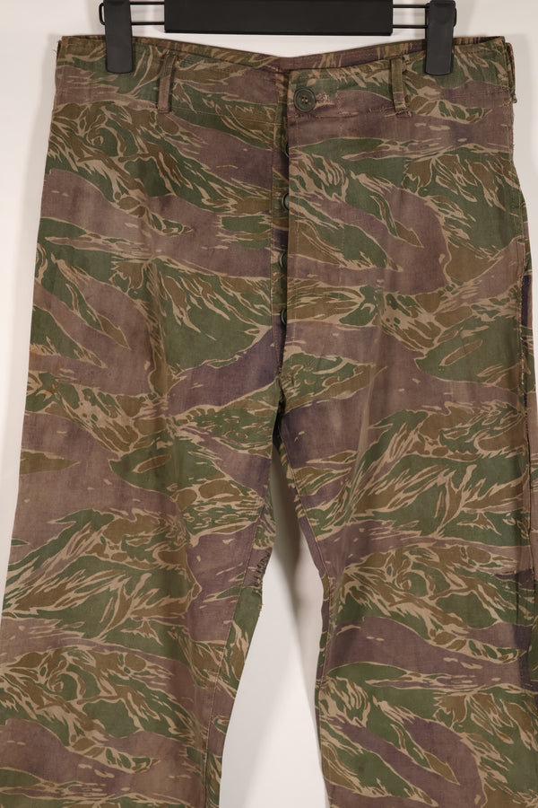 Real tiger stripe pants, silver tiger pattern, tanned, faded, used.