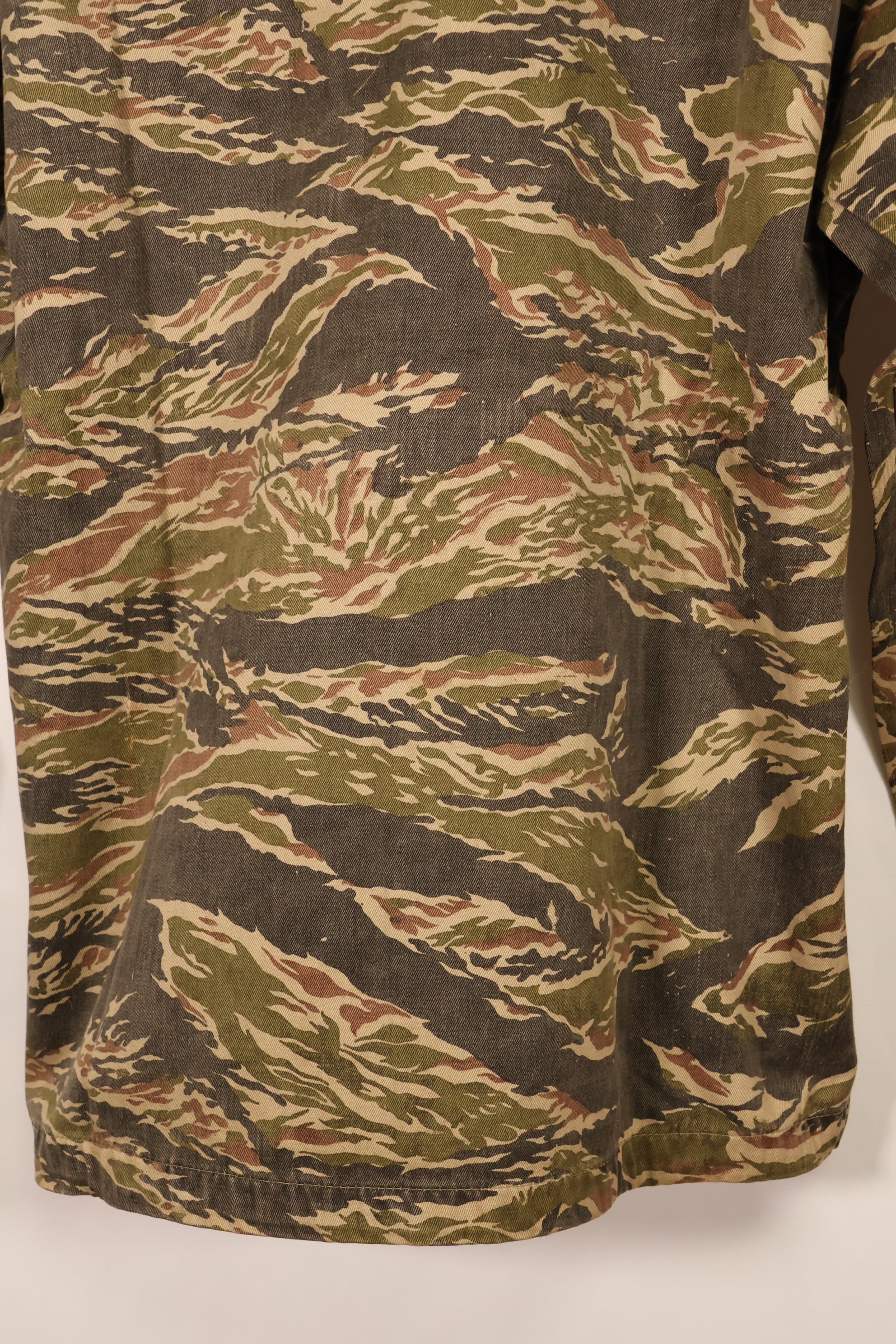 Late 1960s | Locally made | Estimated to be made in Vietnam or Thailand | Tiger-striped shirt | Used