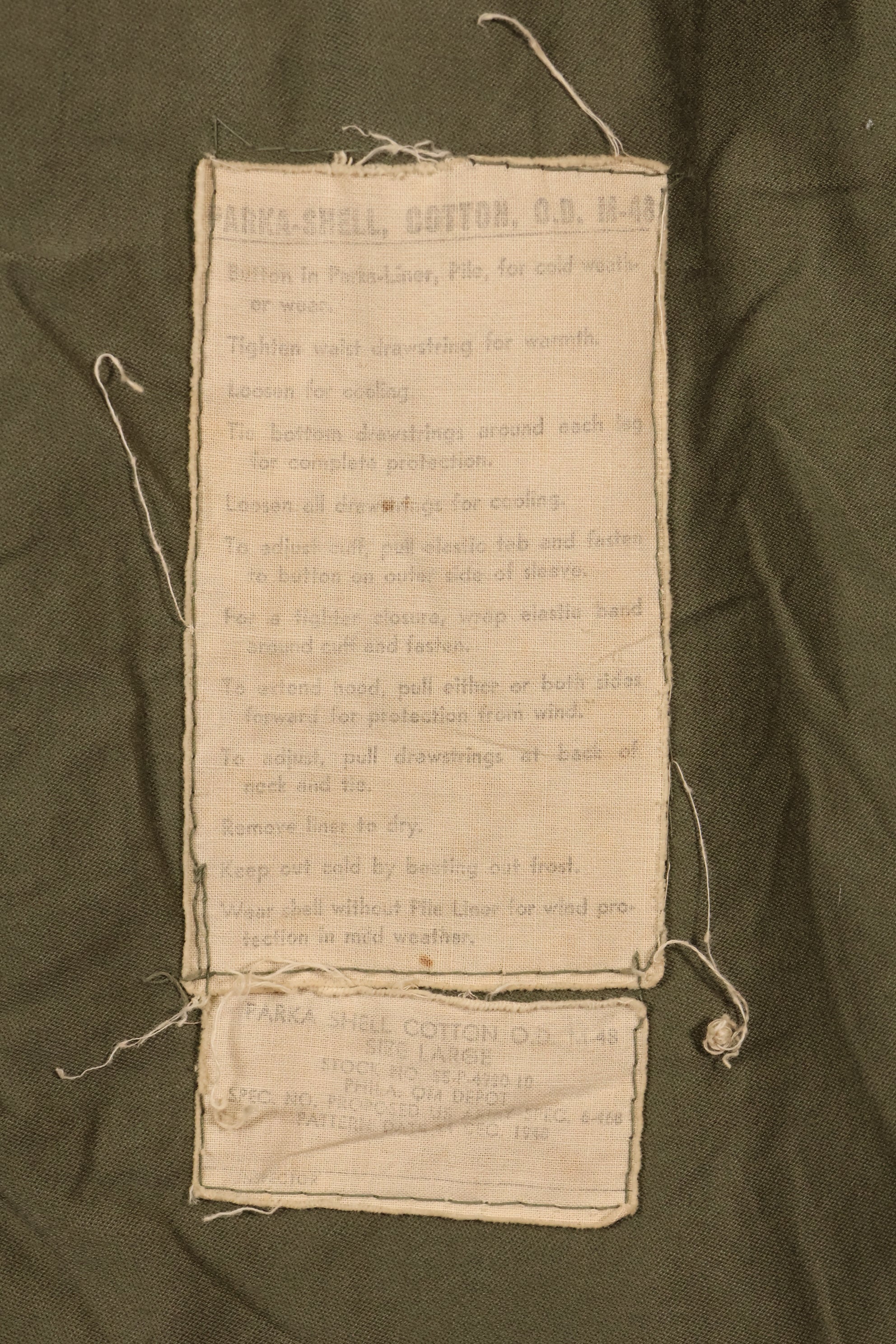 Late 1940's L size US Army M-48 Field Parka with repairs, used movie company costume.