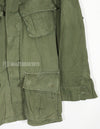 Real 2nd Model Jungle Fatigue Jacket, used, with patches and rank insignia.
