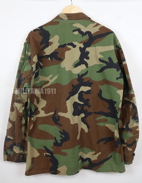 US SURPLUS U.S. Army Special Forces Woodland Camouflage Jacket, 1996, with patches.