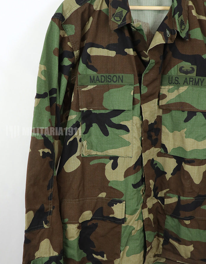 Real U.S. Army Woodland Camouflage Jacket, 2000, with patches.