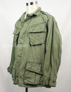 Real 2nd model jungle fatigues jacket, worn, scratched, faded.