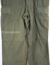 Real 1967 poplin fabric jungle fatigues pants, used, repaired.