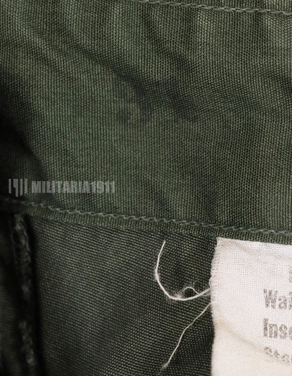 Real 1967 poplin fabric jungle fatigues pants, used, repaired.