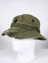 Real U.S. Army boonie hat with metal insignia, faded.
